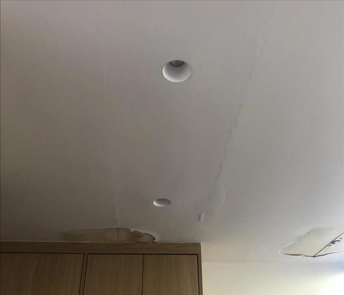 storm damaged ceiling from roof