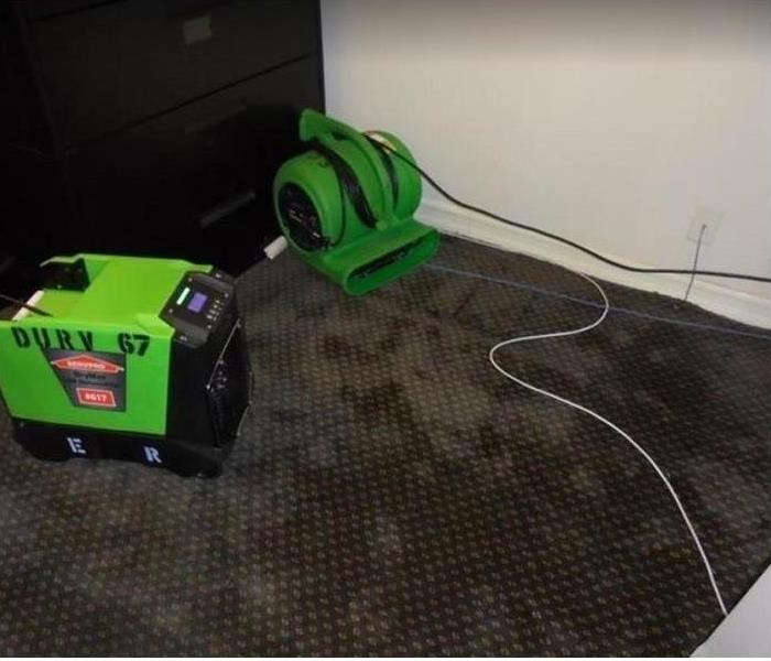 SERVPRO drying equipment on water damaged carpet