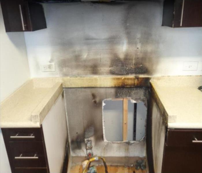 smoke damage on kitchen wall and cabinets 