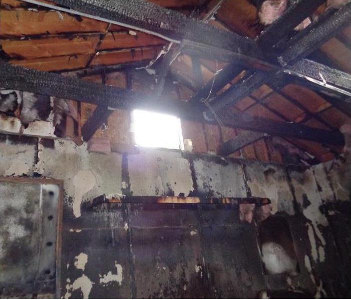 ceiling rafters burned and charred walls