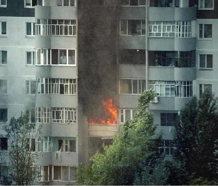 fire in balcony of hi-rise apt building
